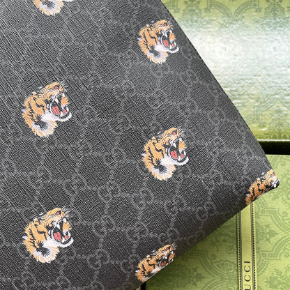 CLUTCH WITH TIGER PRINT 30 IN BLACK MONOGRAM CANVAS