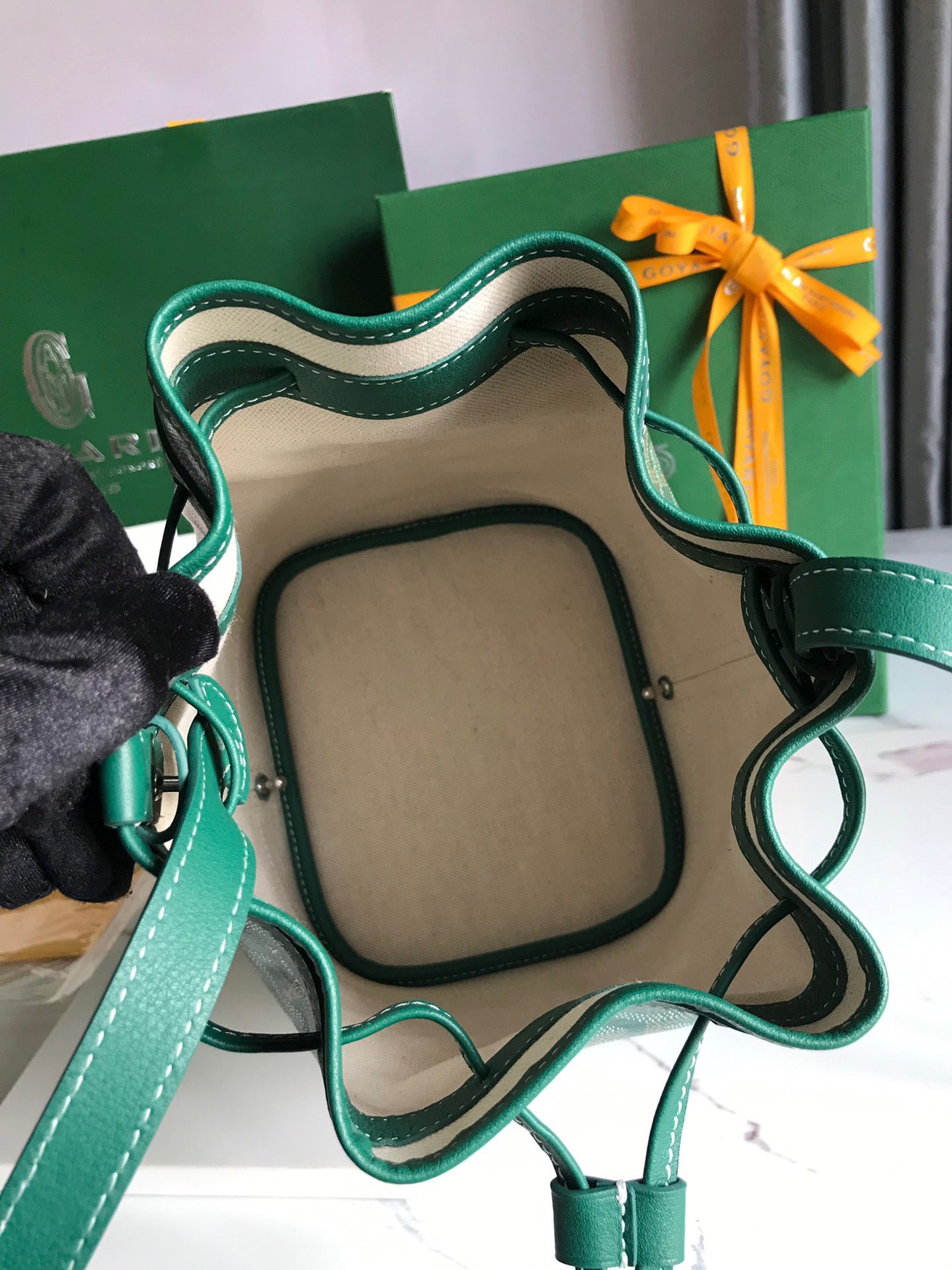 PETIT FLOT BUCKET BAG 22 IN GREEN GOYARDINE CANVAS AND LAMBSKIN TRIM