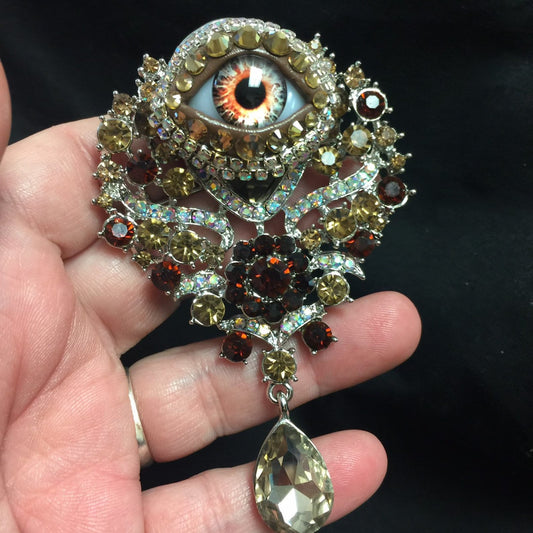 Vintage Ornate Eyeball Brooch: Amber Glass Iris, Rhinestones