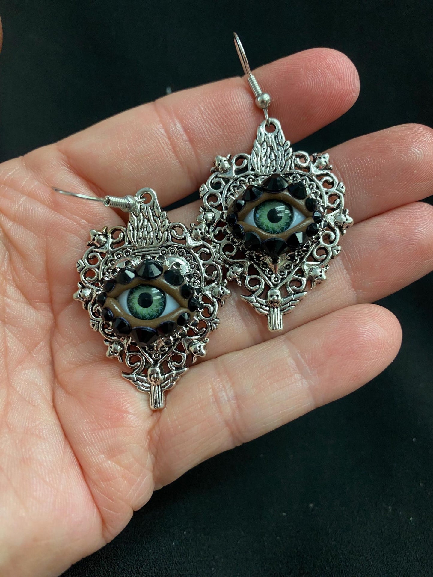 Silver Tone Sacred Heart Eyeball Earrings with Skull Accents