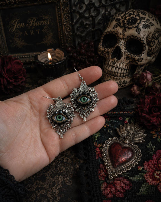 Silver Tone Sacred Heart Eyeball Earrings with Skull Accents