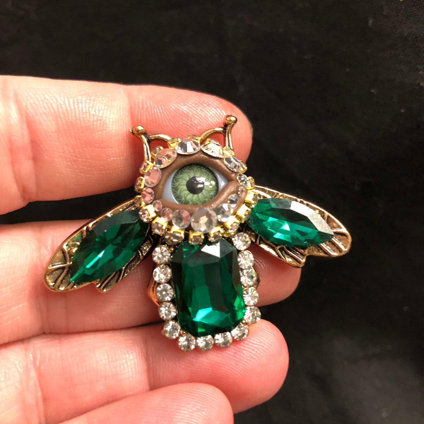 Little Baby Bee! Bejeweled Emerald Green Insect Eyeball Art Brooch with a Natural Green Eye and and Hand Placed Rhinestones!