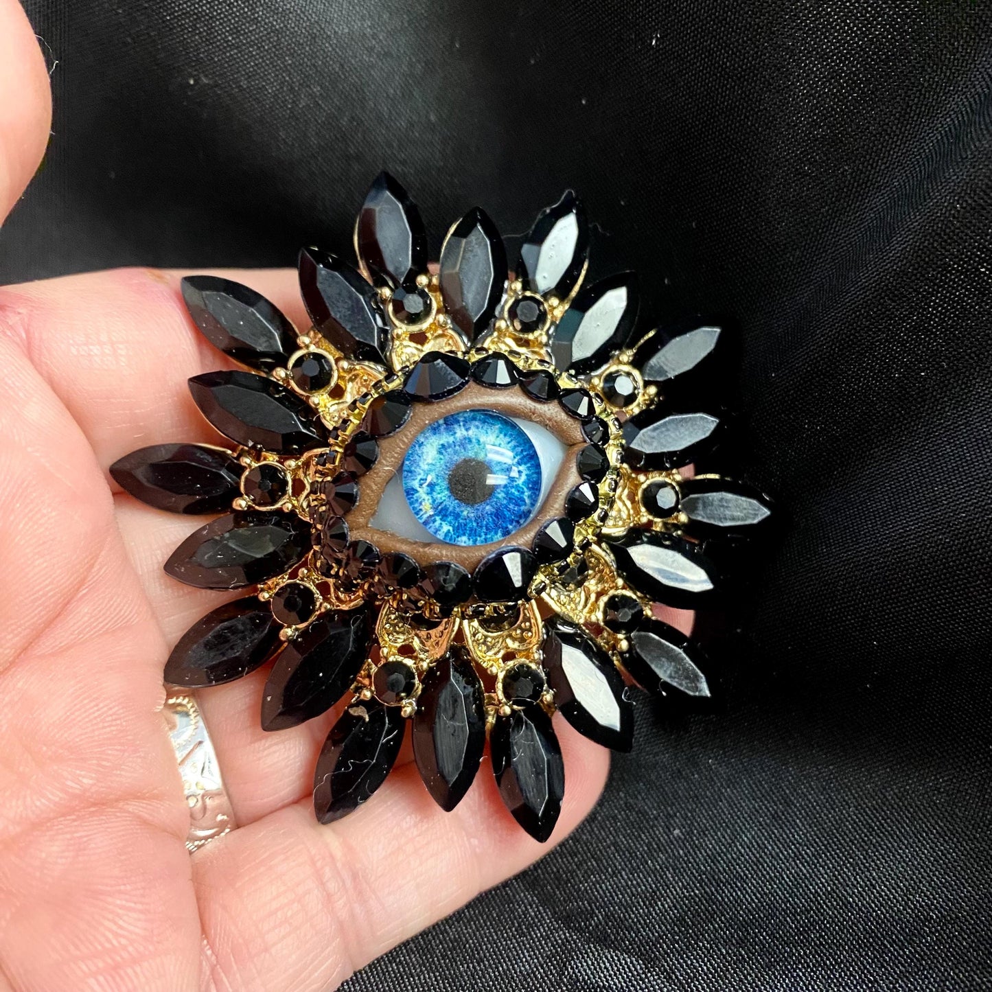 Vintage Style Sunburst Brooch: Jet Black Rhinestones with Handmade Blue Glass Iris