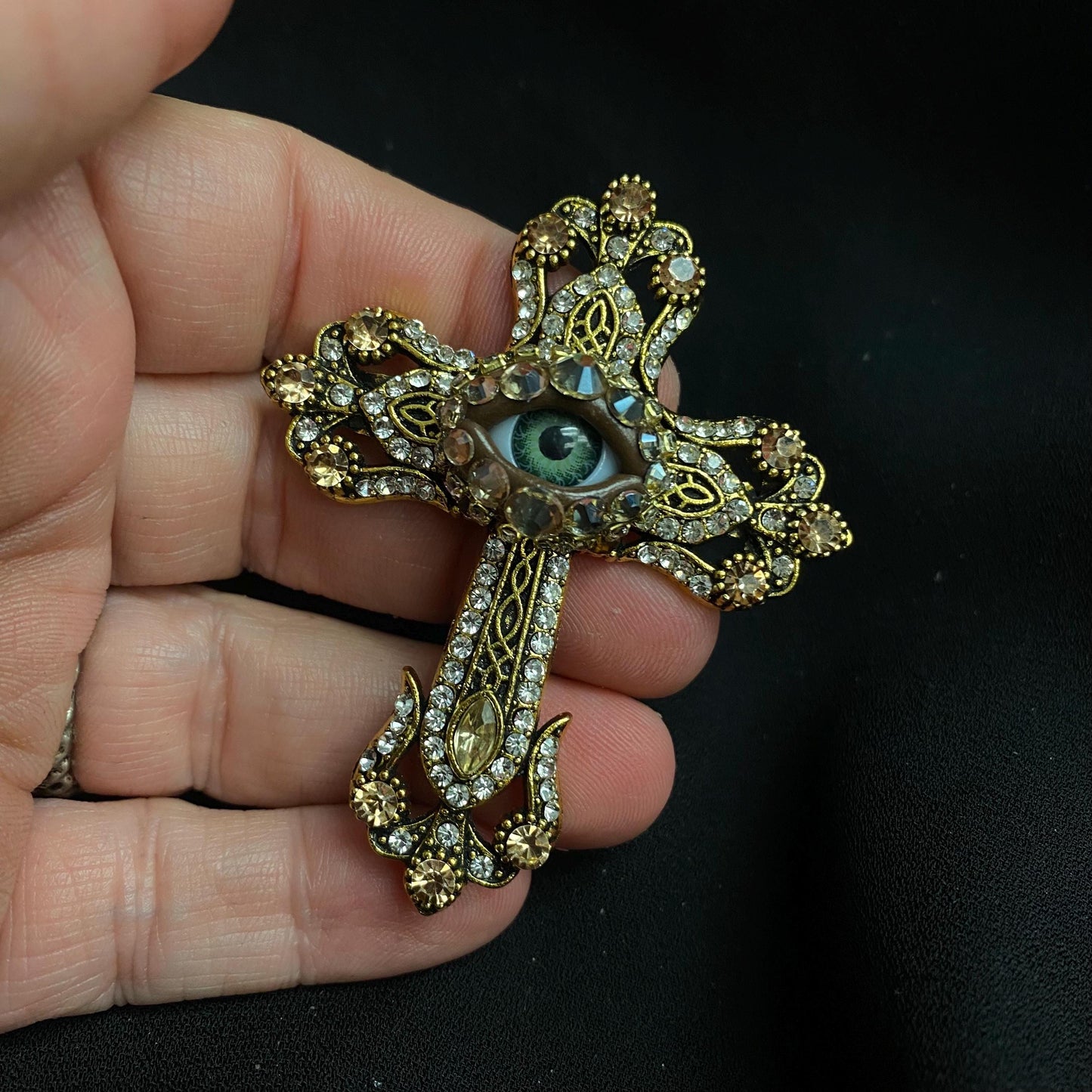 Ornate Vintage Style Rhinestone Eyeball Art Cross Brooch Pin. Golden Tone Hand Placed Rhinestones!