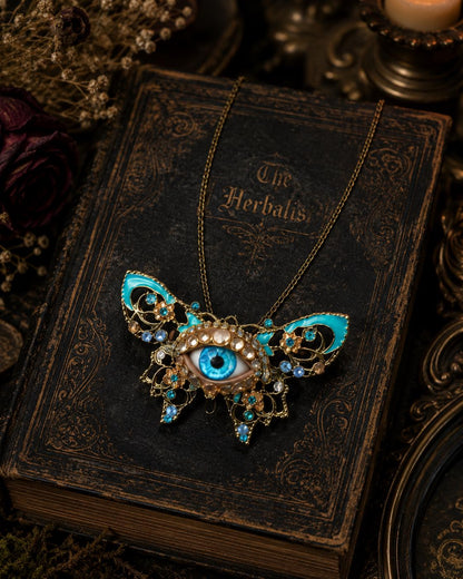 Surreal Evil Eye Butterfly Necklace | Blue Glass Eye Pendant
